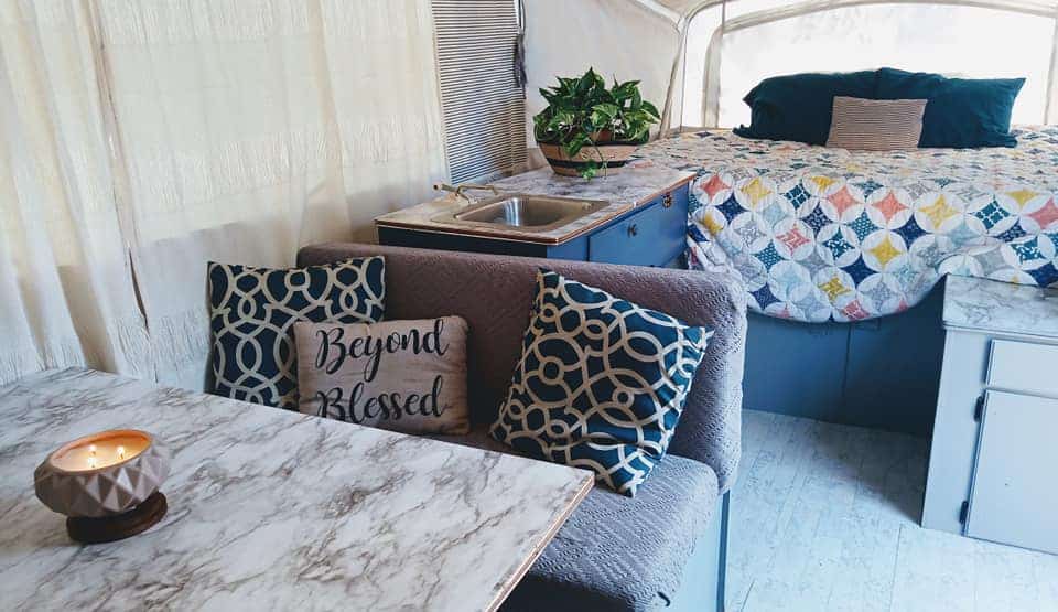 This DIY pop-up camper remodel is stunning! Not to mention, it was done on a super-tight budget and the whole family helped!