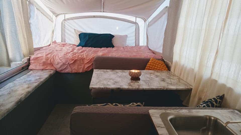 This DIY pop-up camper remodel is stunning! Not to mention, it was done on a super-tight budget and the whole family helped!