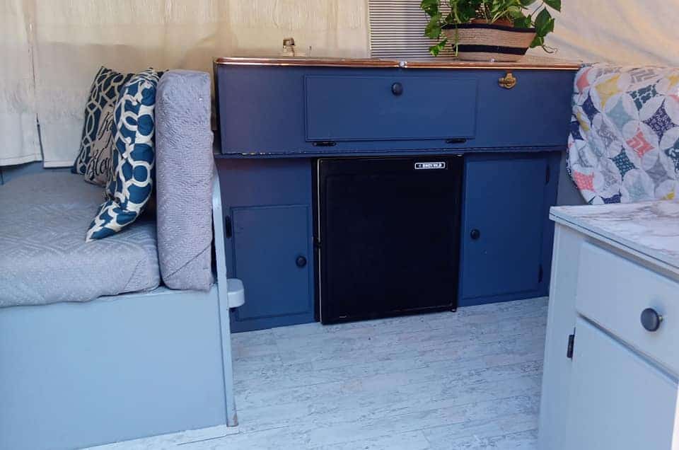 This DIY pop-up camper remodel is stunning! Not to mention, it was done on a super-tight budget and the whole family helped!